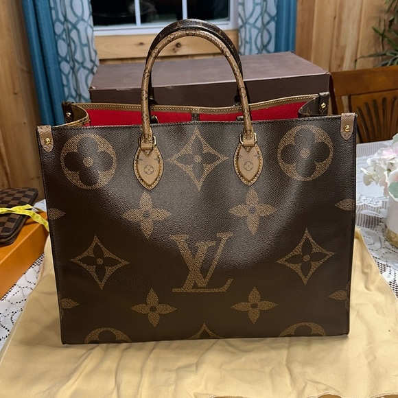 Louis Vuitton Handbags - Louis Vuitton Brown Tote Bag with Iconic Monogram Design and Structured Shape